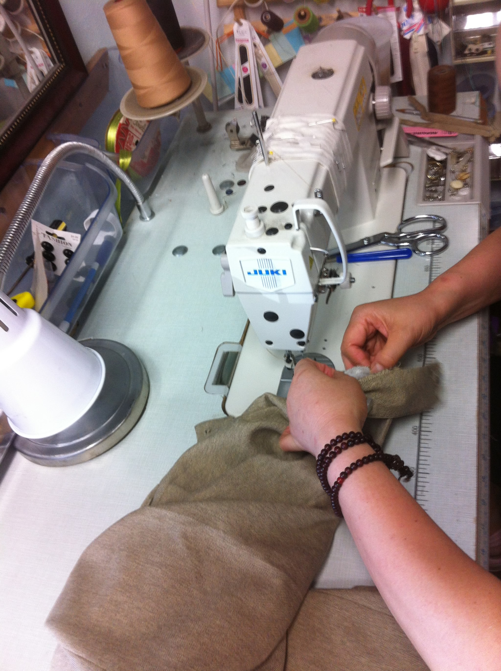 Seamstress and Juki Sewing Machine in Action
